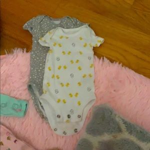 Set of Carter’s preemie onesies
